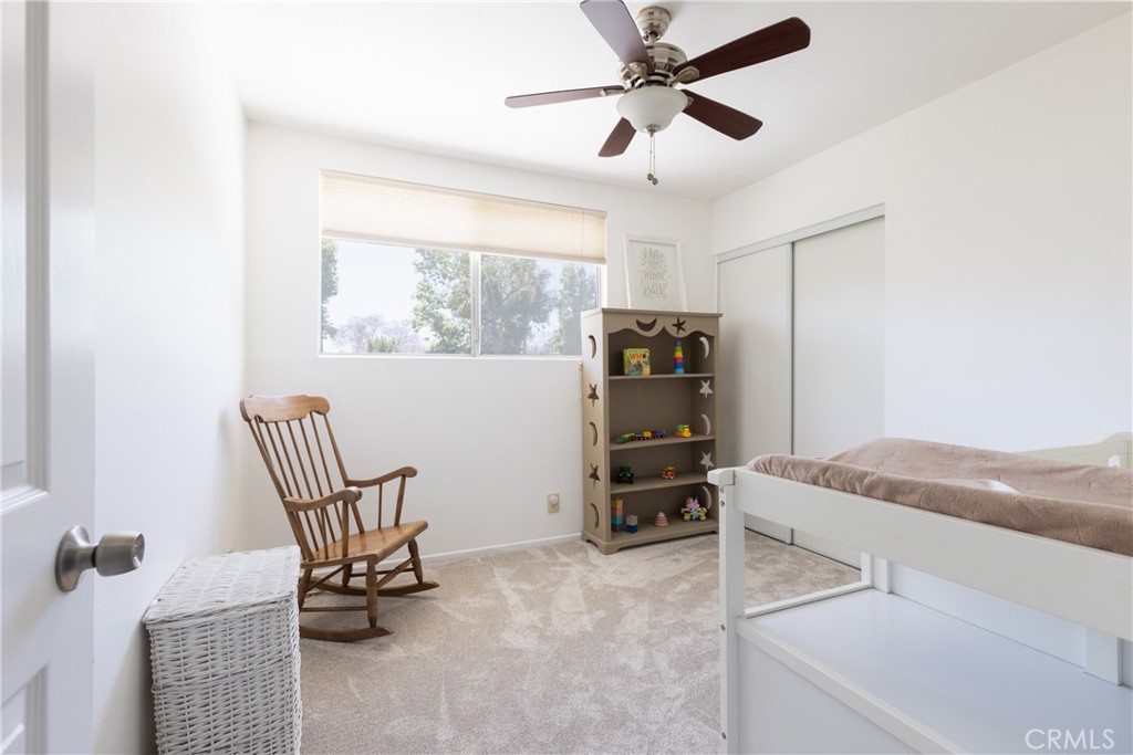 94 Wildwood, Unit 11 Irvine, CA 92604 - Photo 23 of 41 a bedroom with furniture and a window