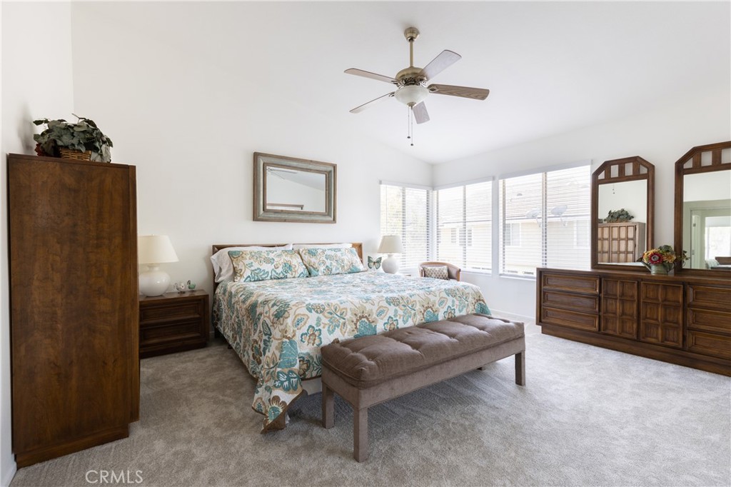 94 Wildwood, Unit 11 Irvine, CA 92604 - Photo 25 of 41 a bedroom with a bed and wooden floor