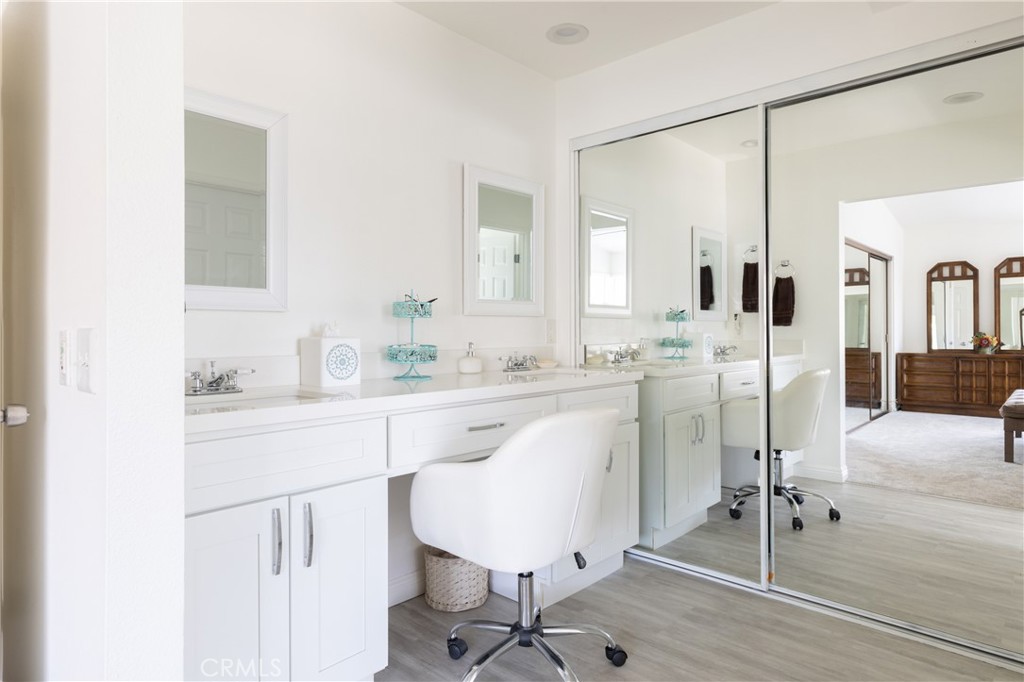 94 Wildwood, Unit 11 Irvine, CA 92604 - Photo 28 of 41 a spacious bathroom with a sink and a mirror