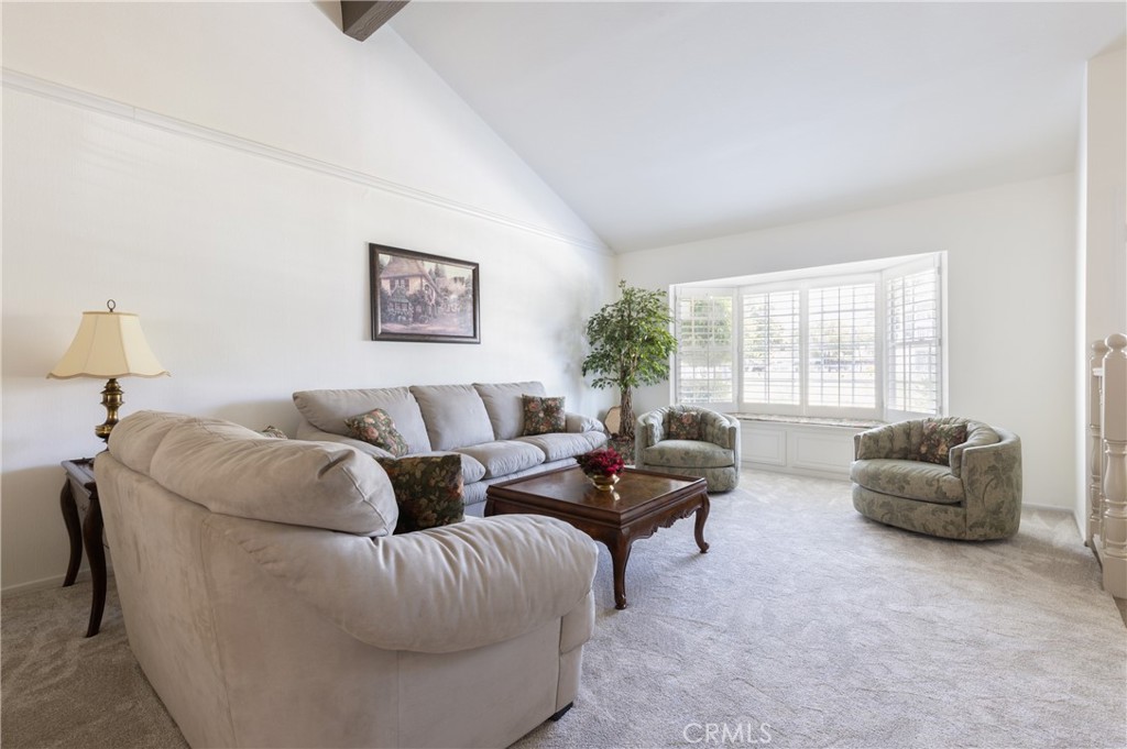 94 Wildwood, Unit 11 Irvine, CA 92604 - Photo 3 of 41 a living room with furniture and a window