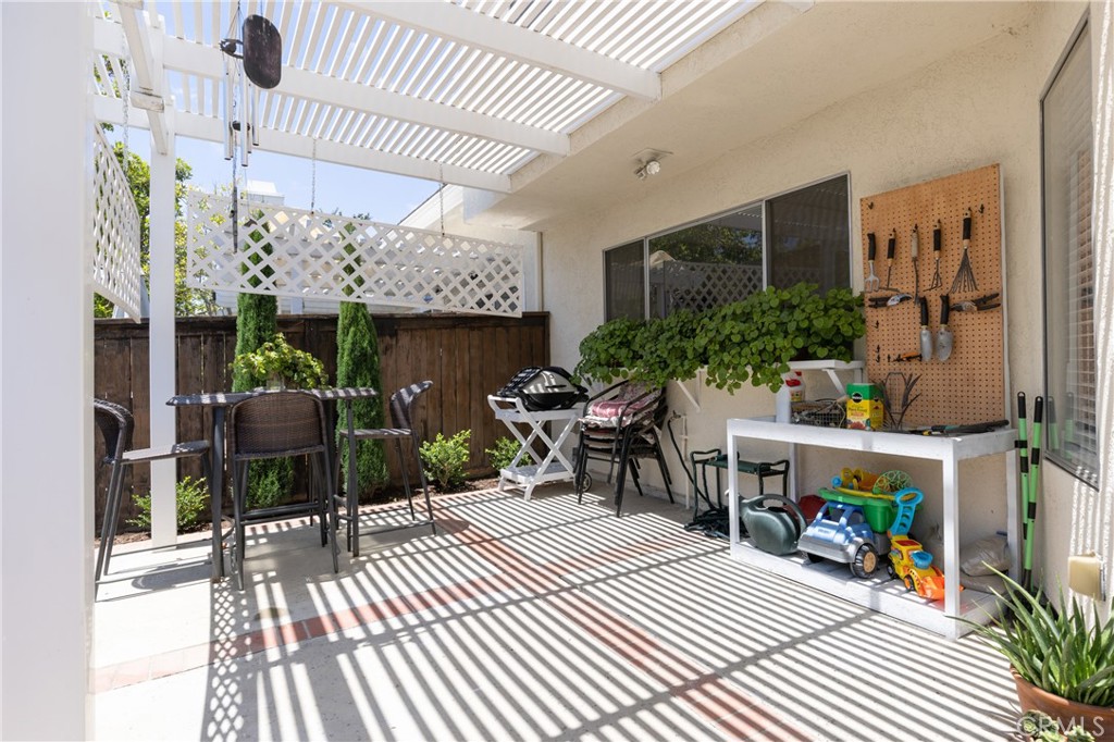 94 Wildwood, Unit 11 Irvine, CA 92604 - Photo 32 of 41 a view of a chairs and table in a patio
