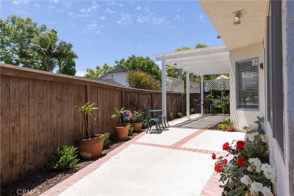 94 Wildwood, Unit 11 Irvine, CA 92604 - Photo 35 of 41 a view of a backyard with a patio