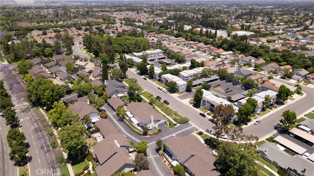 94 Wildwood, Unit 11 Irvine, CA 92604 - Photo 39 of 41 an aerial view of a city with lots of residential buildings