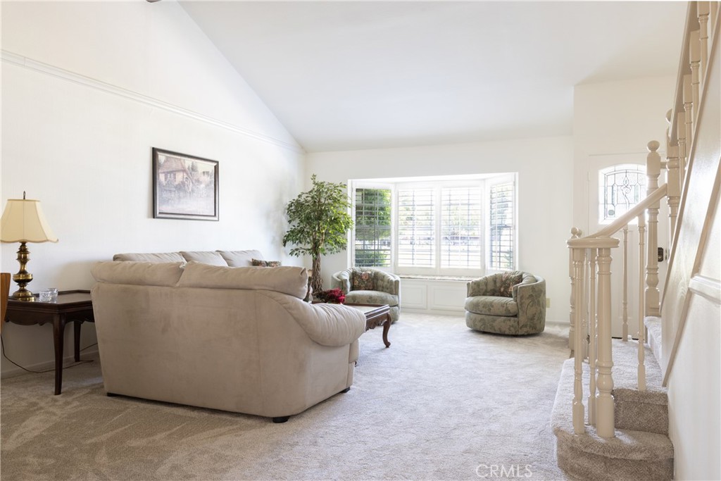 94 Wildwood, Unit 11 Irvine, CA 92604 - Photo 5 of 41 a living room with furniture and a large window