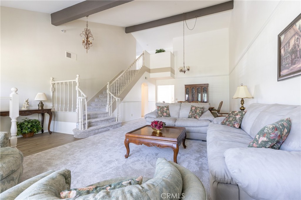 94 Wildwood, Unit 11 Irvine, CA 92604 - Photo 6 of 41 a living room with furniture and a fireplace