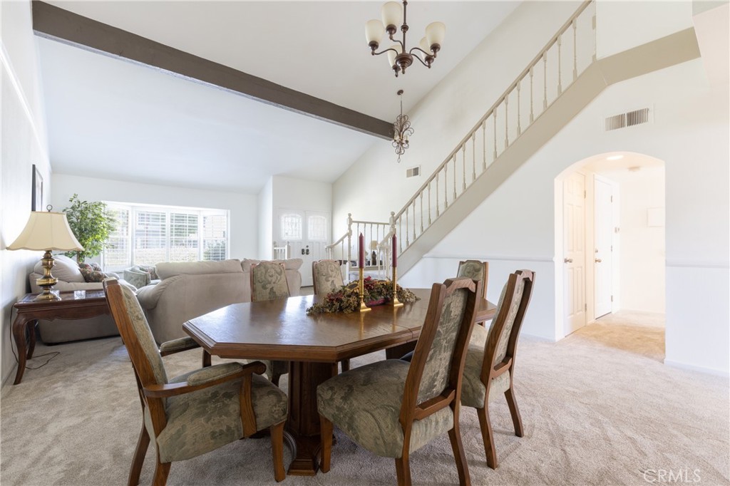 94 Wildwood, Unit 11 Irvine, CA 92604 - Photo 7 of 41 a view of a dining room with furniture and wooden floor