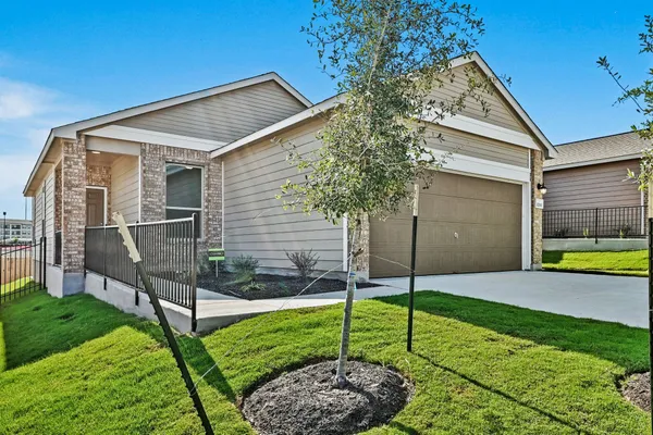 a house view with a backyard space