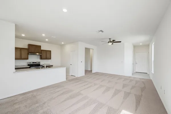 a view of a kitchen with a sink and a stove