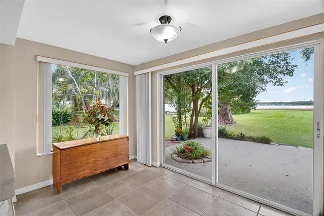 a kitchen with granite countertop a stove a sink and a fireplace