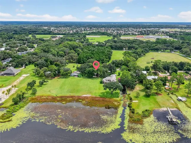 a view of a garden with a building in the background