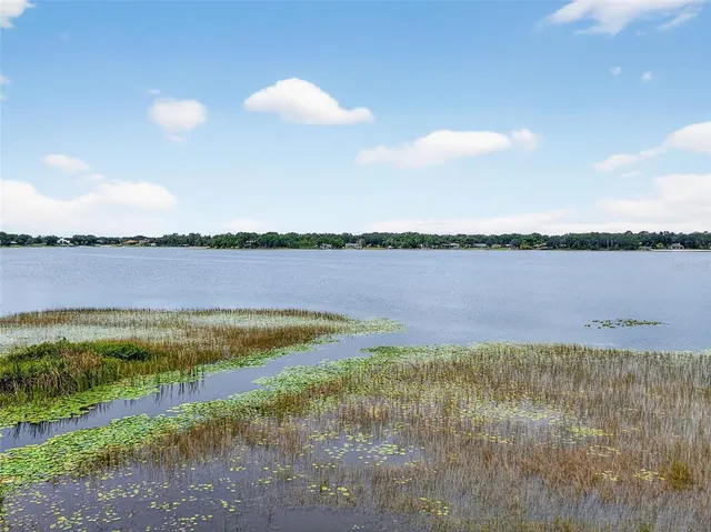 a spacious bathroom with a glass door shower
