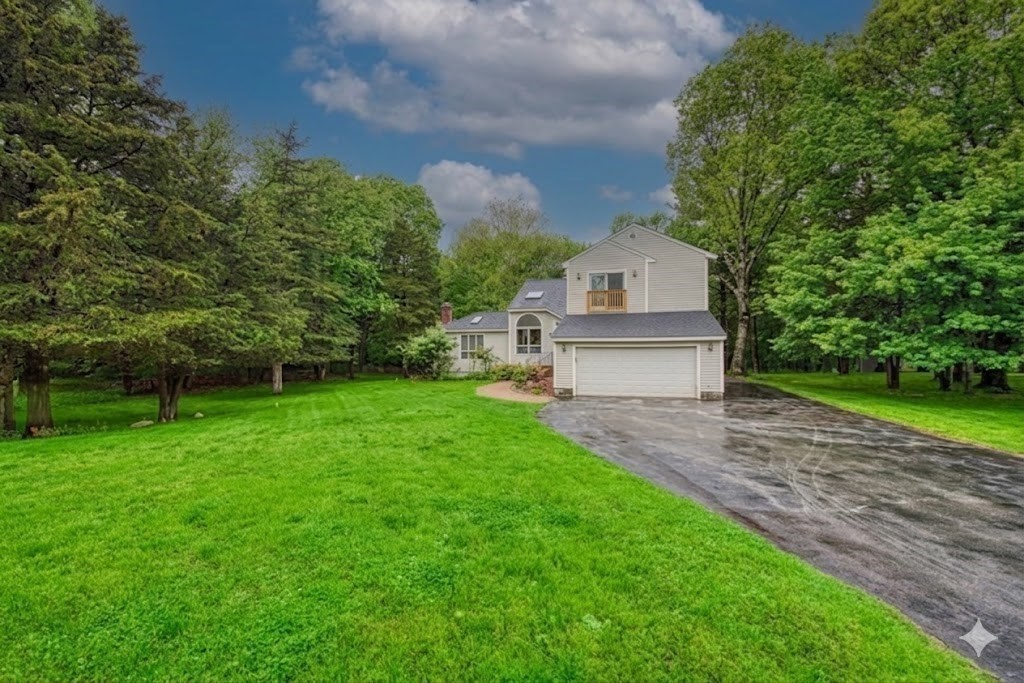 7 Tisdale Road Sharon, MA 02067 - Photo 35 of 37 a front view of a house with a yard