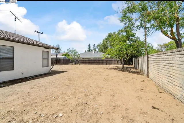 a view of a backyard of the house