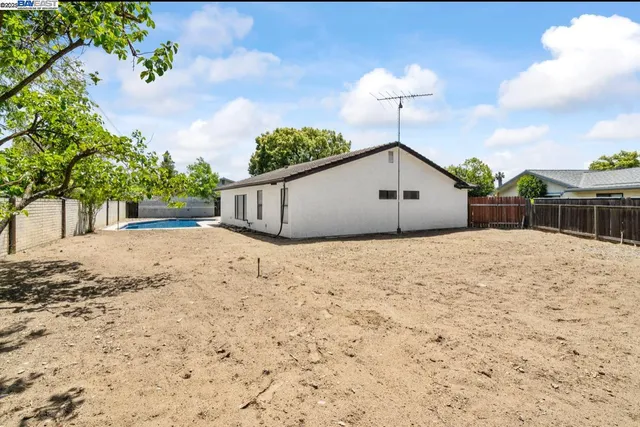a house view with a backyard
