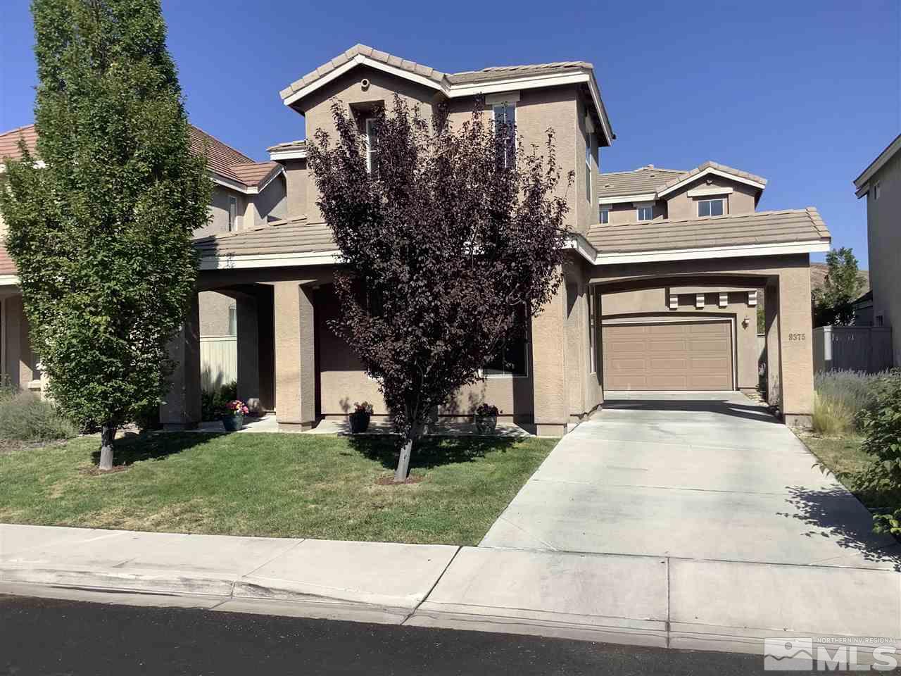 9375 Hummer Court Reno, NV 89521 - Photo 1 of 23 front view of a house with a yard