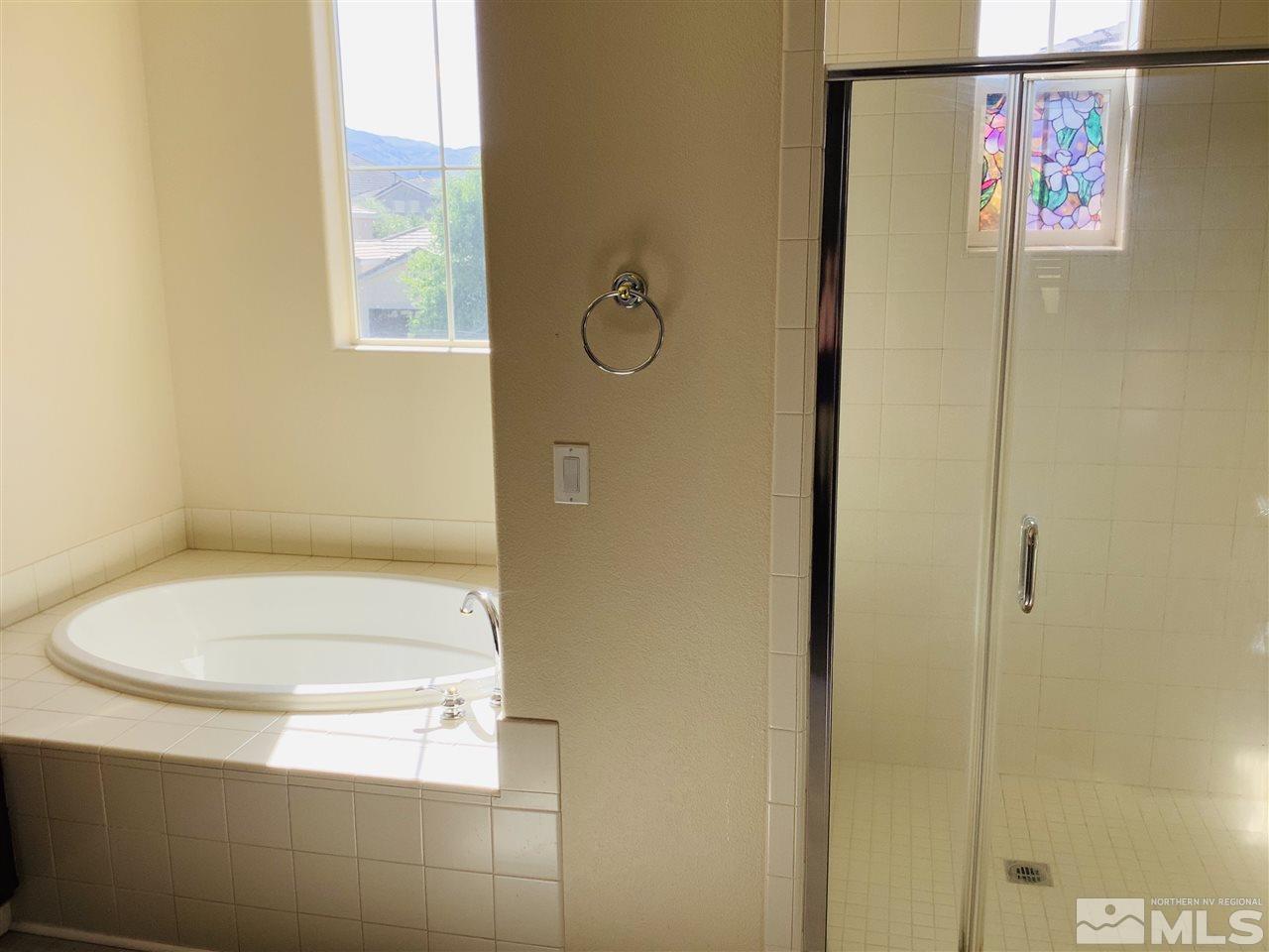 9375 Hummer Court Reno, NV 89521 - Photo 20 of 23 a bathroom with a toilet and a shower