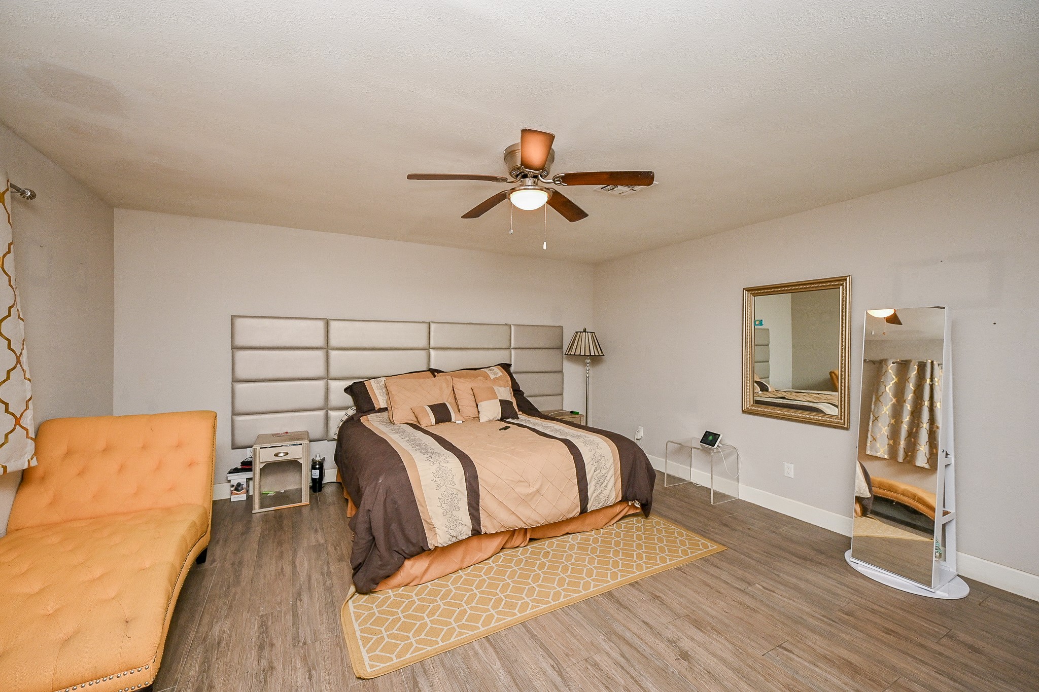 2406 Encreek Road Houston, TX 77068 - Photo 17 of 25 a bedroom with a bed and wooden floor