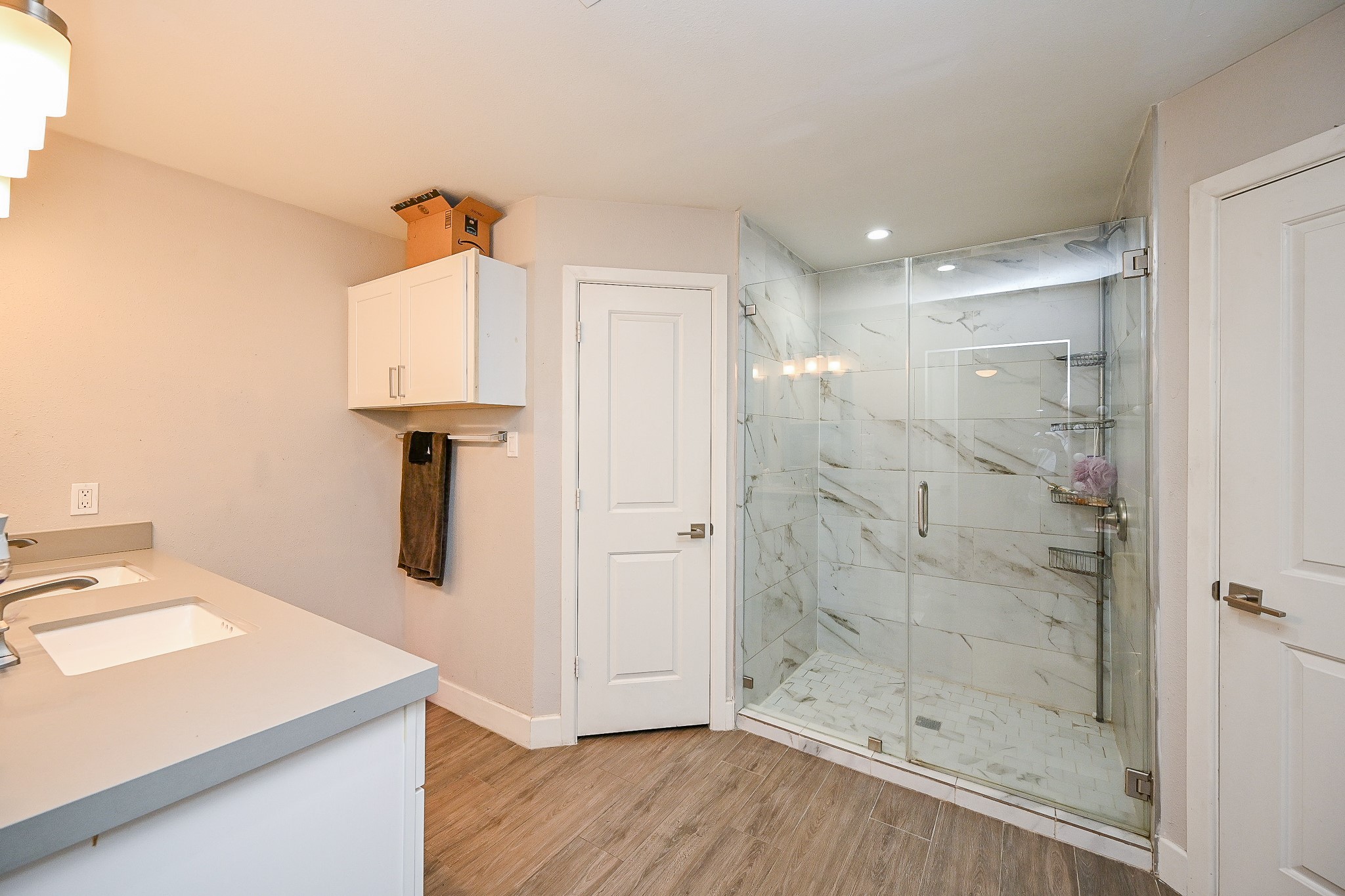 2406 Encreek Road Houston, TX 77068 - Photo 19 of 25 a bathroom with a shower sink and mirror