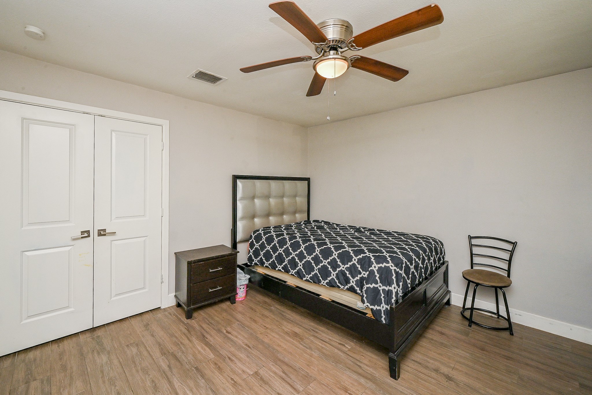 2406 Encreek Road Houston, TX 77068 - Photo 20 of 25 a bedroom with a bed and a ceiling fan