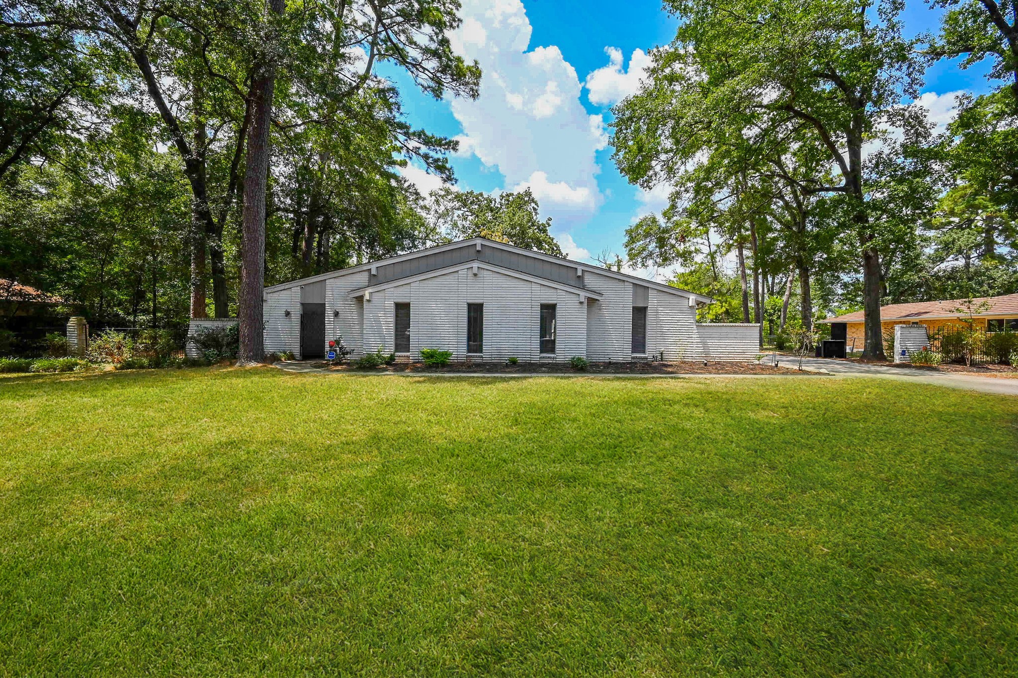 2406 Encreek Road Houston, TX 77068 - Photo 23 of 25 a view of house with a garden