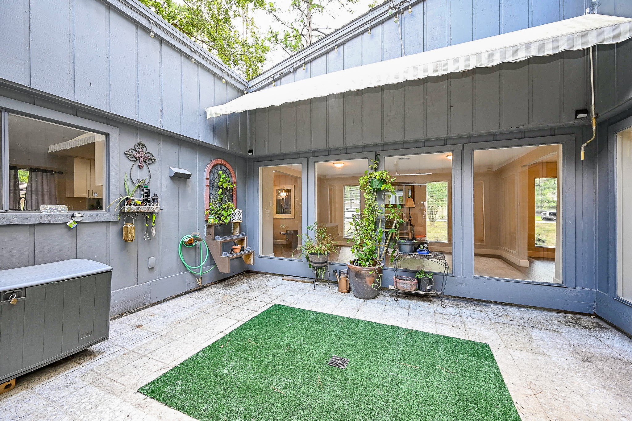 2406 Encreek Road Houston, TX 77068 - Photo 4 of 25 a backyard of a house with outdoor seating