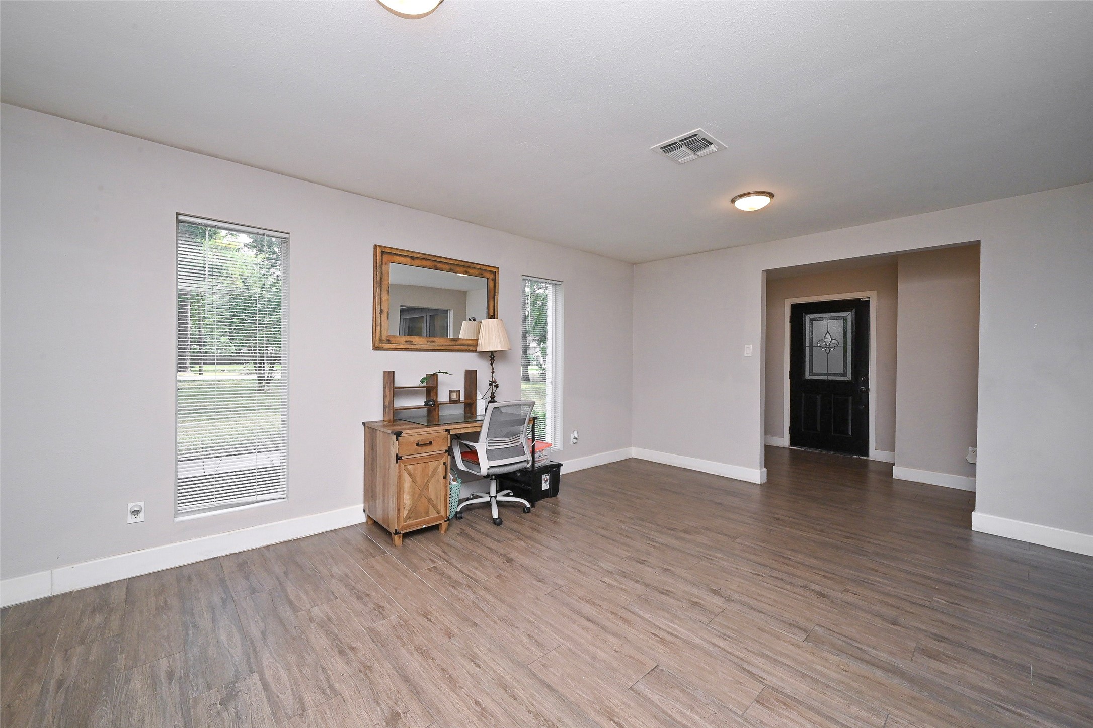 2406 Encreek Road Houston, TX 77068 - Photo 6 of 25 an empty room with furniture and windows