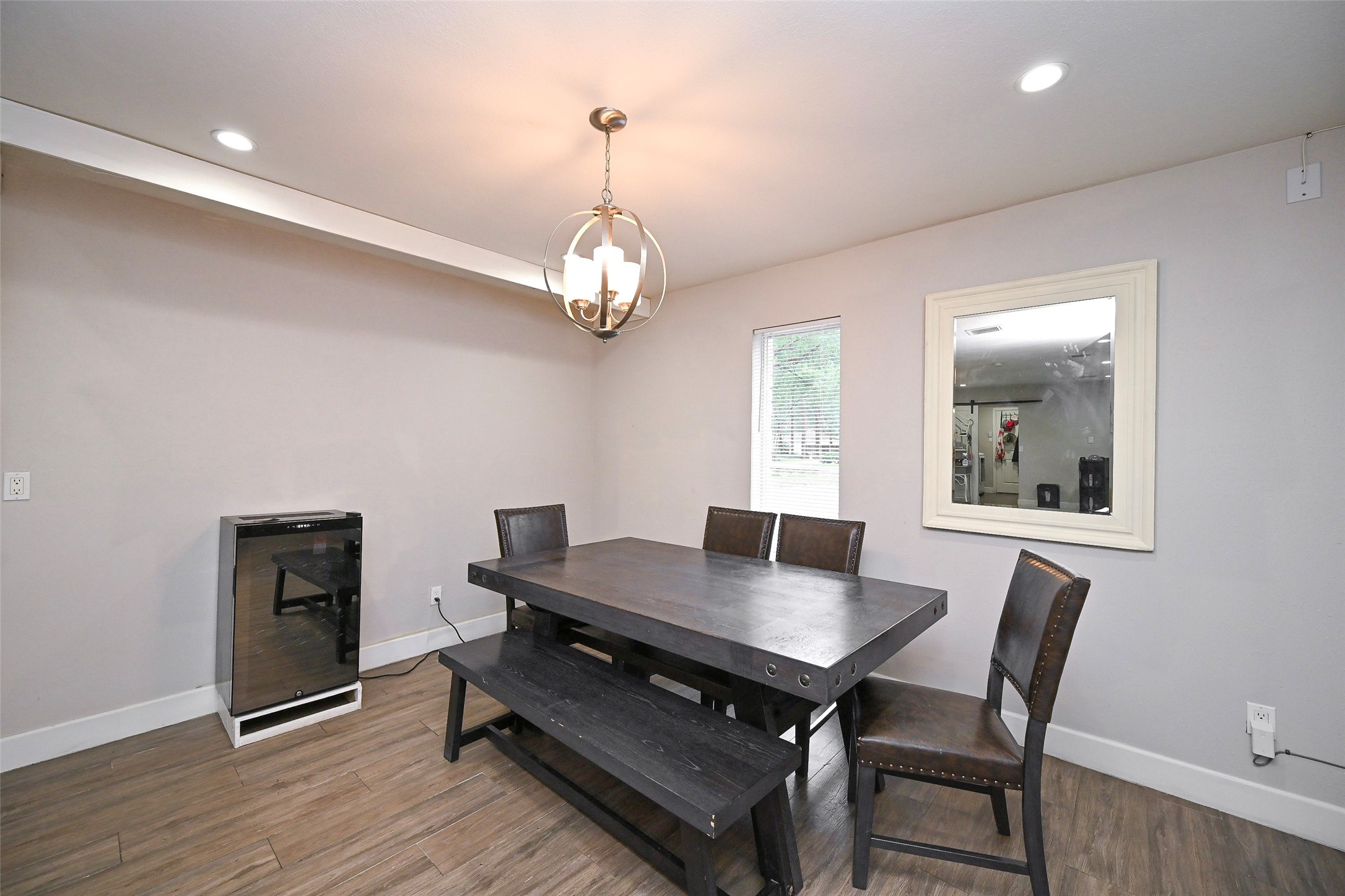 2406 Encreek Road Houston, TX 77068 - Photo 10 of 25 a view of a dining room with furniture and wooden floor