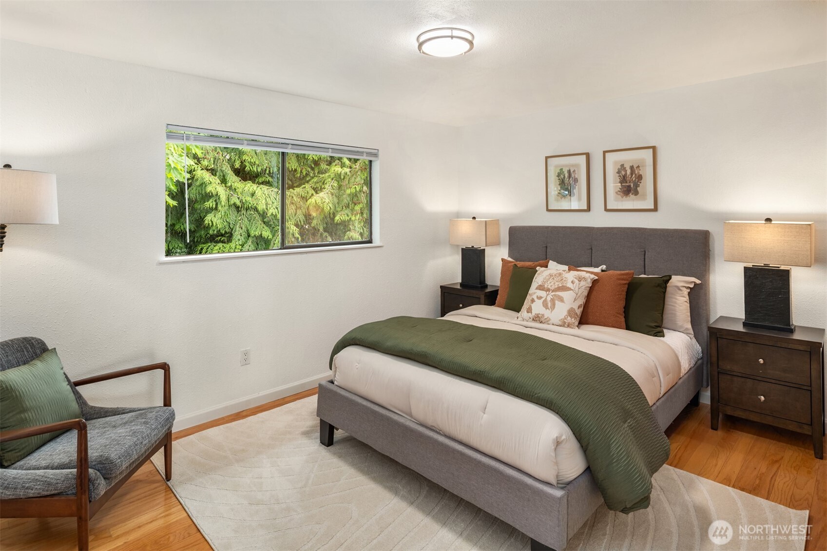 418 212th Street Southwest Bothell, WA 98021 - Photo 18 of 40 a spacious bedroom with a bed and a lamp