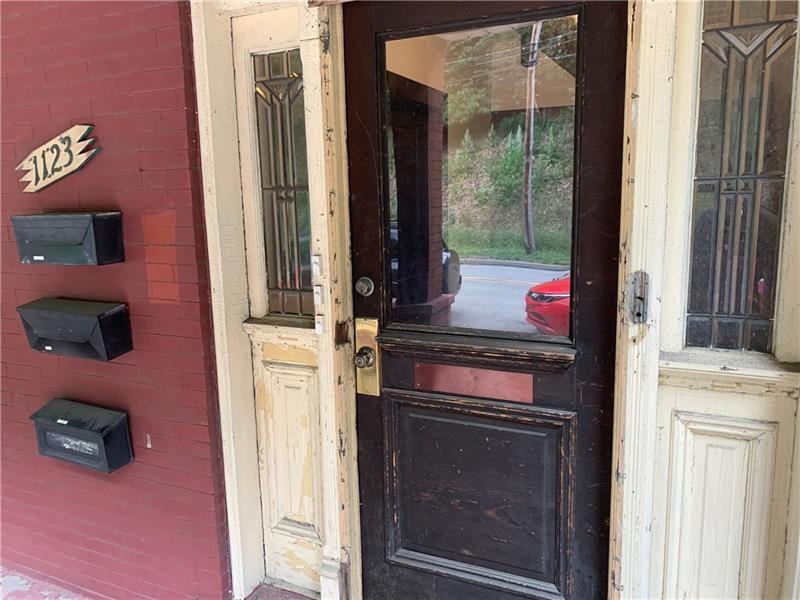 1123 Evergreen Road, Unit 2 Pittsburgh, PA 15209 - Photo 5 of 14 a kitchen with a stove and a microwave