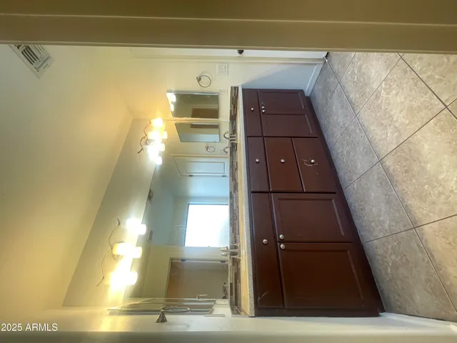 a view of entryway with a bathtub