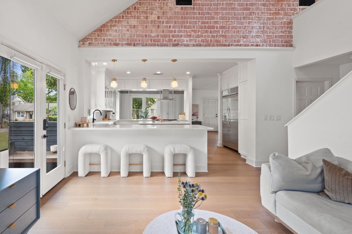 Tons of light and open living space in this Pemberton charmer with exposed brick and contemporary meets classic finishes.