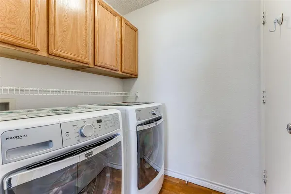 a view of storage and utility room with washer and dryer
