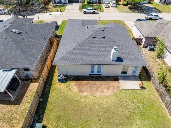 an aerial view of a house with swimming pool