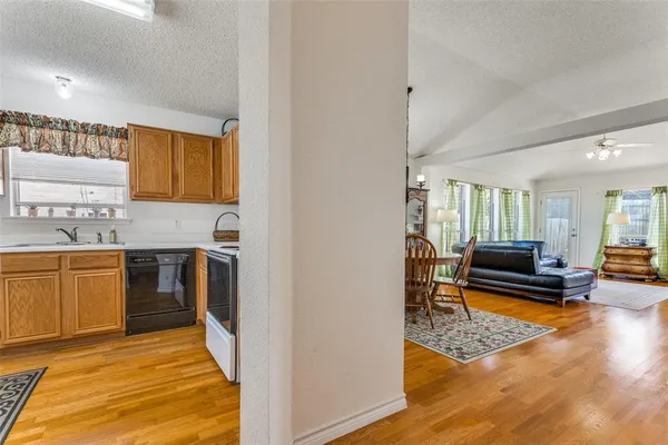 a bedroom with a bed a couch and dresser in it