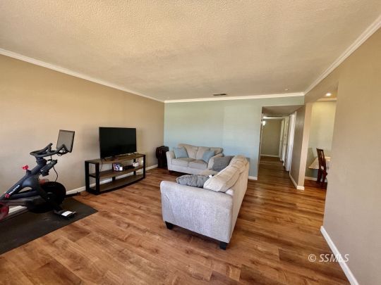 401 South Lincoln Street Ridgecrest, CA 93555 - Photo 2 of 27 a living room with furniture and a flat screen tv