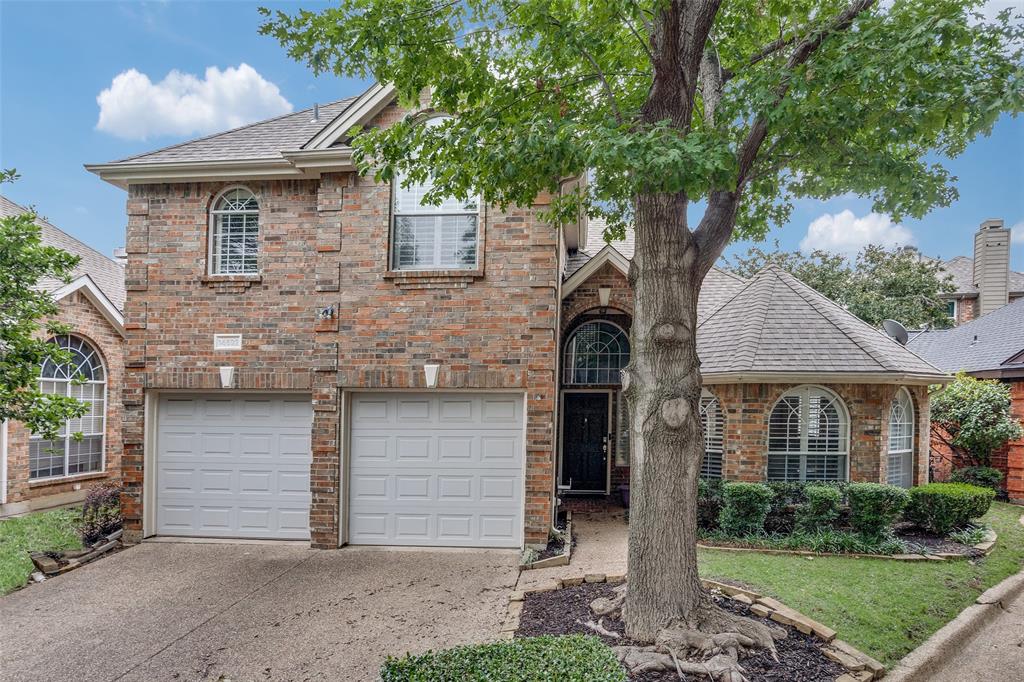 14592 Evergreen Court Addison, TX 75001 - Photo 1 of 1 View of front of property featuring a garage, a shingled roof, concrete driveway, and brick siding