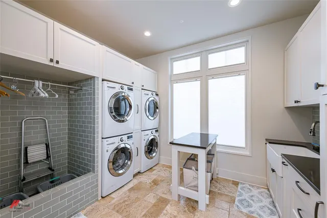 a utility room with sink dryer and washer