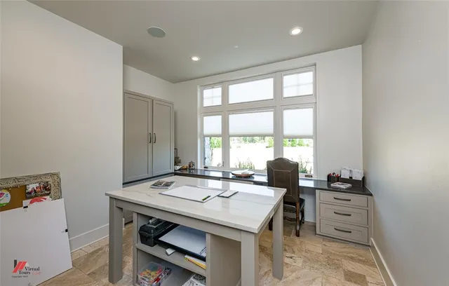 a view of a dining room with furniture and window