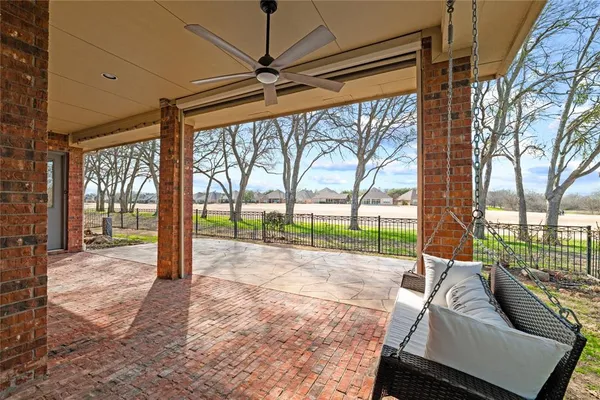 a living room with couch and a floor to ceiling window