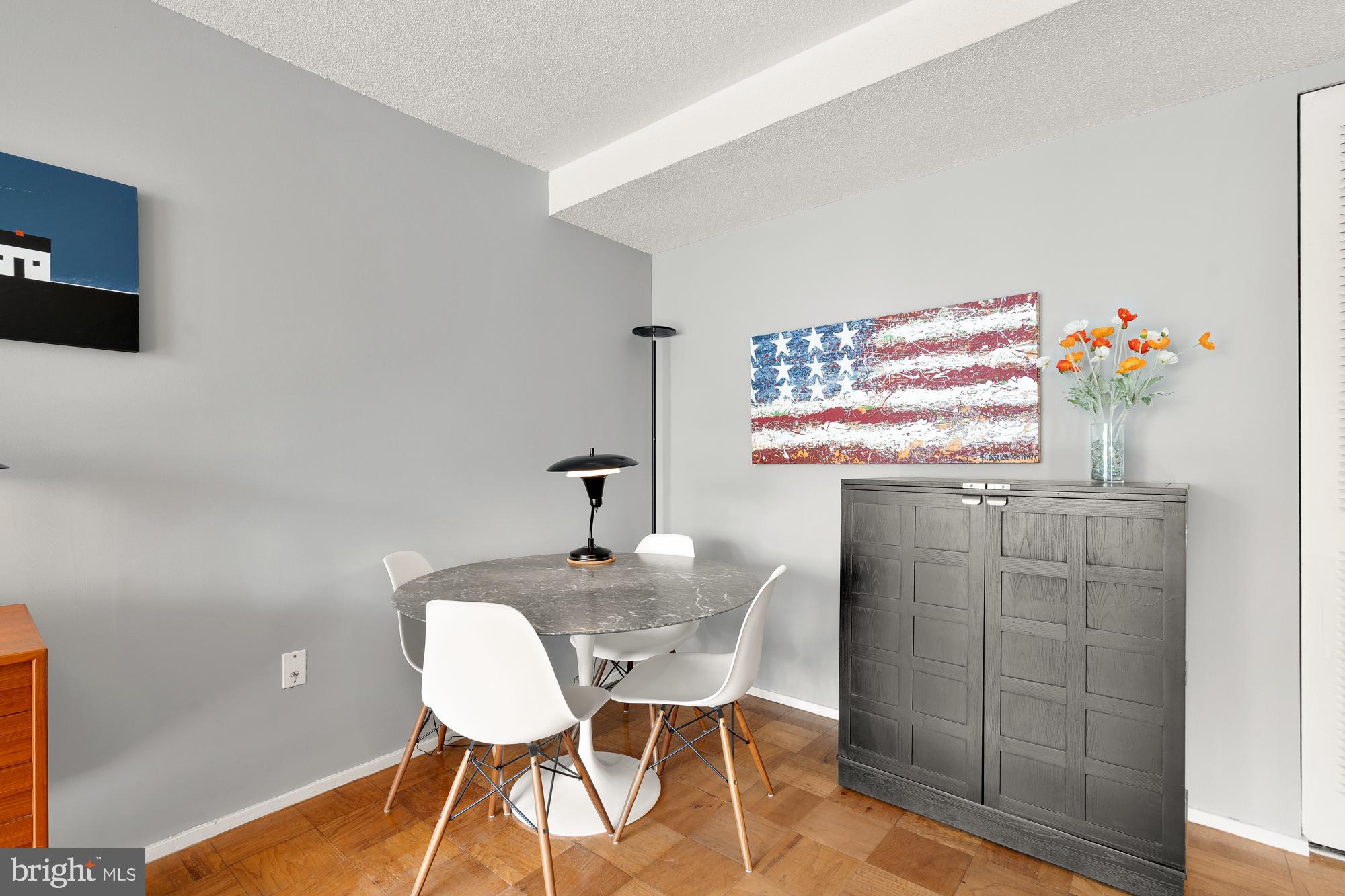 1311 Delaware Avenue Southwest, Unit S528 Washington, DC 20024 - Photo 8 of 17 a dining room with furniture and wooden floor