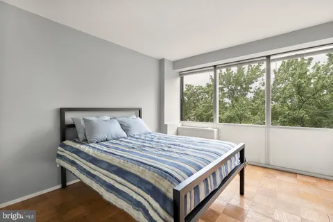 a bedroom with a bed and closet