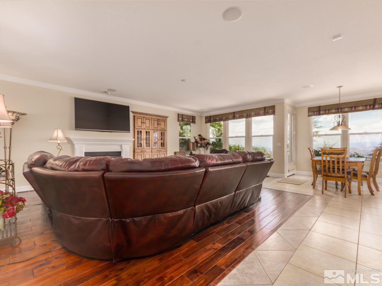 2938 Flint Ridge Court Reno, NV 89511 - Photo 6 of 25 a living room with furniture and a flat screen tv