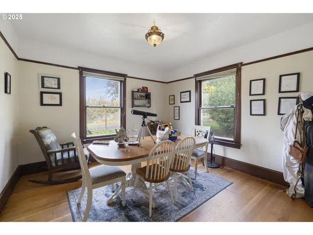 a dining room with furniture and window