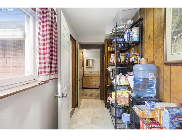 a view of a livingroom with furniture and a window