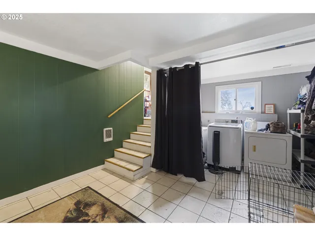 a view of kitchen with wooden floor and electronic appliances