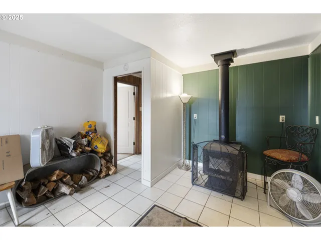 a living room with furniture and a mirror