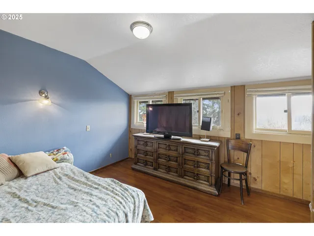 a bedroom with a bed and furniture