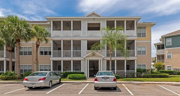 a car parked in front of a brick building