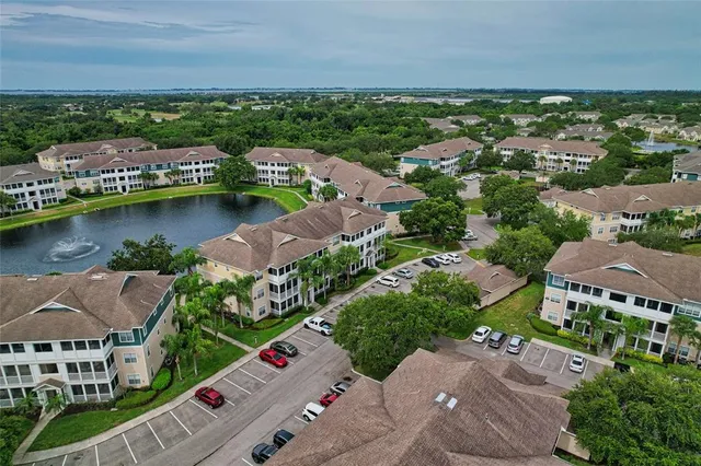 an aerial view of a house with a lake view