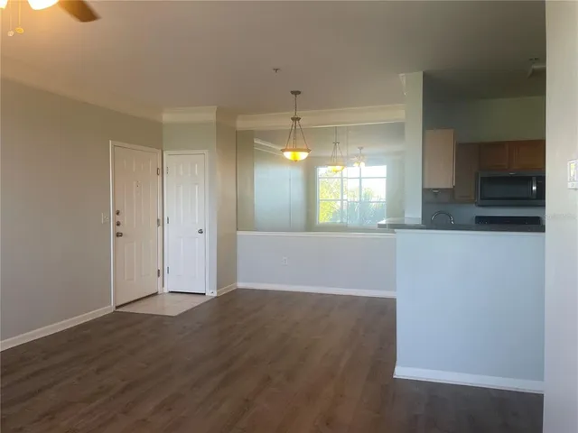 a view of a kitchen cabinets and wooden floor